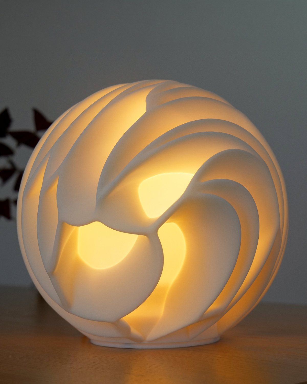 Nawar lamp glowing warm, petal folds lit from within